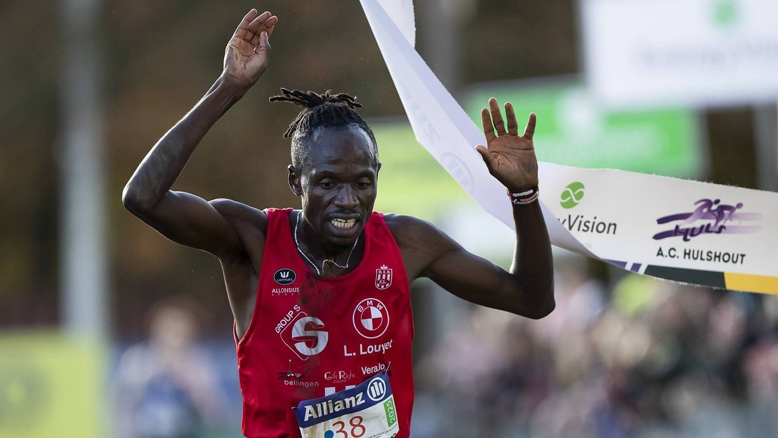 Belgian Isaac Kimeli celebrates as he crosses the finish line to win the men elite race of the CrossCup cross country running athletics event in Hulshout, the third stage of the CrossCup competition and the Belgian Championships, Sunday 17 November 2024. BELGA PHOTO KRISTOF VAN ACCOM