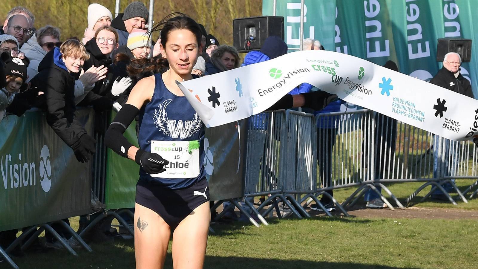 Belgian Chloe Herbiet celebrates as she crosses the finish line at the women's race at the CrossCup cross country running athletics event in Diest, the fifth and final stage of the CrossCup competition, Sunday 16 February 2025. BELGA PHOTO JILL DELSAUX